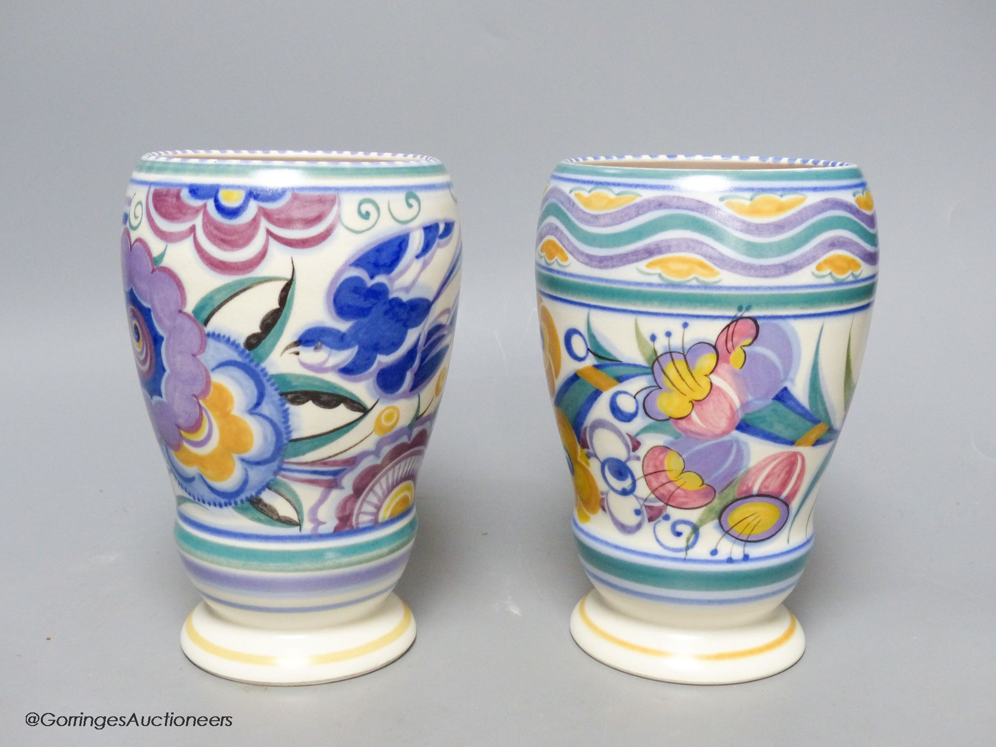 Two 1930's Poole Pottery polychrome vases, height 18cm